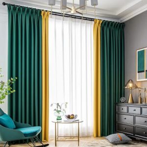 Luxury emerald green and gold curtains with white sheer curtains in a modern living room